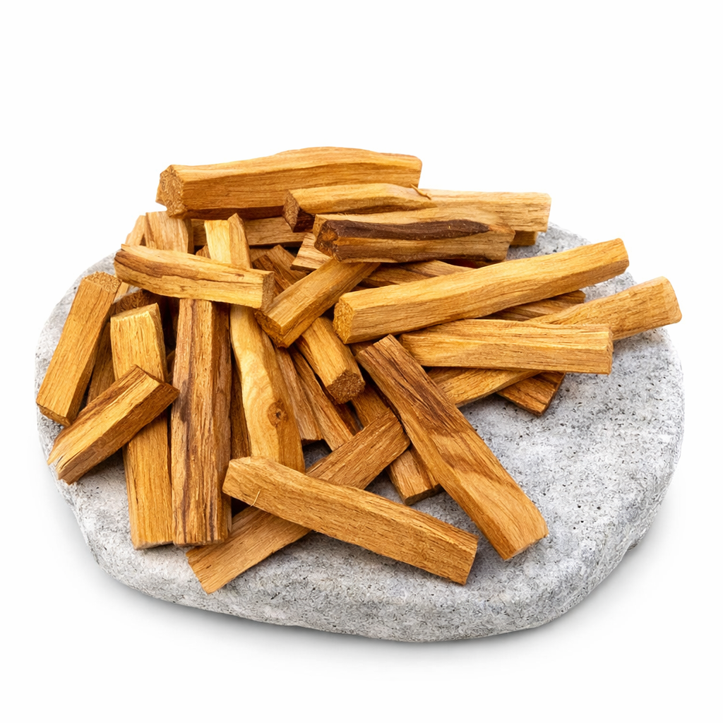 Wooden Palo Santo sticks on a stone surface with a white background - Clover's Charm