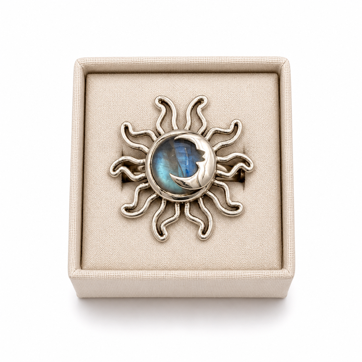 Sterling silver sun and moon ring with round moonstone gemstone displayed in a soft linen jewelry box on a white background -Clover's Charm.