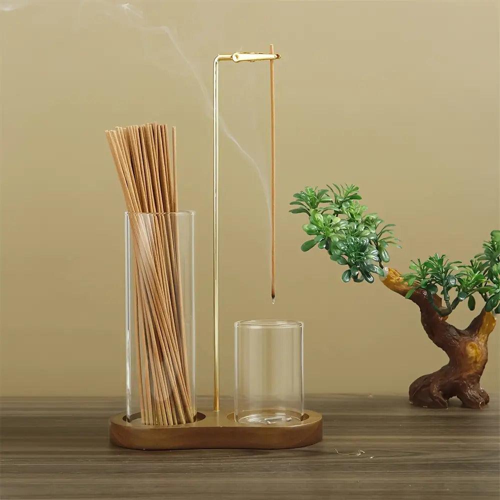 Modern candle light decor set with gold metal arm and two clear glass candle holders on a wooden base retro