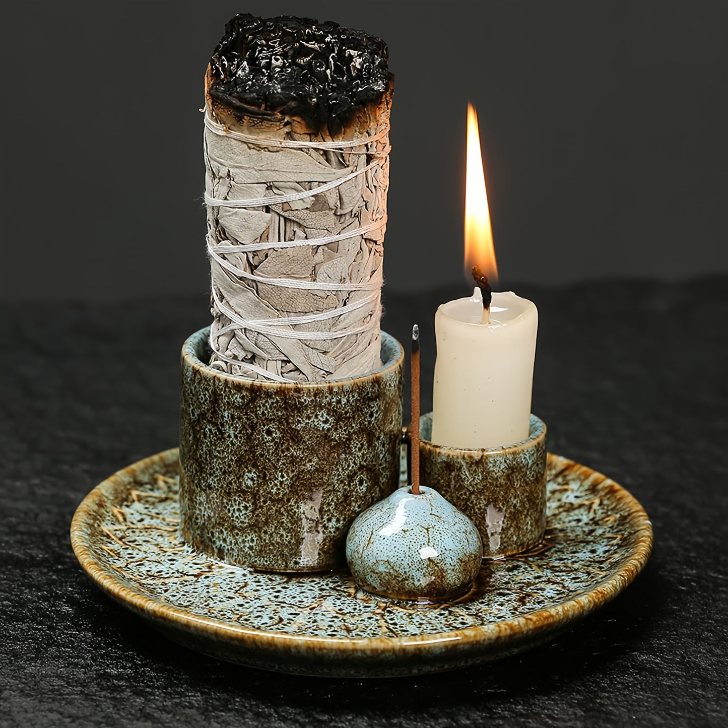 Glazed ceramic incense burner tray with upright incense holder and small candle cup on round textured base