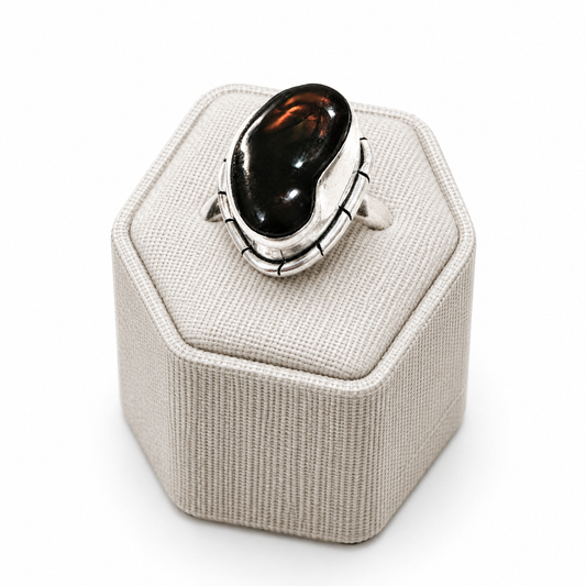 Mexican fire opal ring in size 7 by Sacred Crystals featuring a vibrant eye of fire gemstone set in a silver band.
