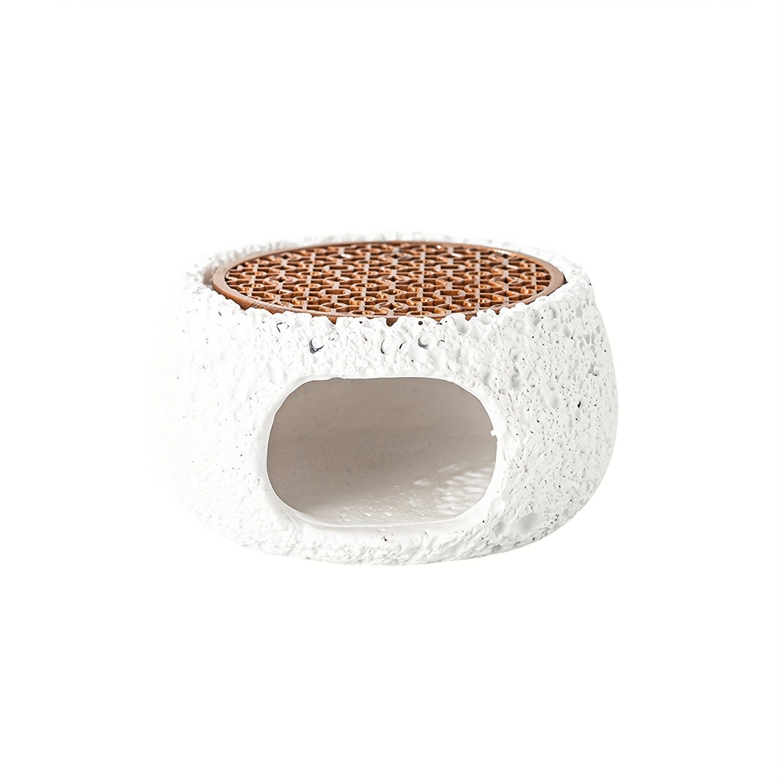 White stone incense holder bowl with textured finish with a visible inside opening.

