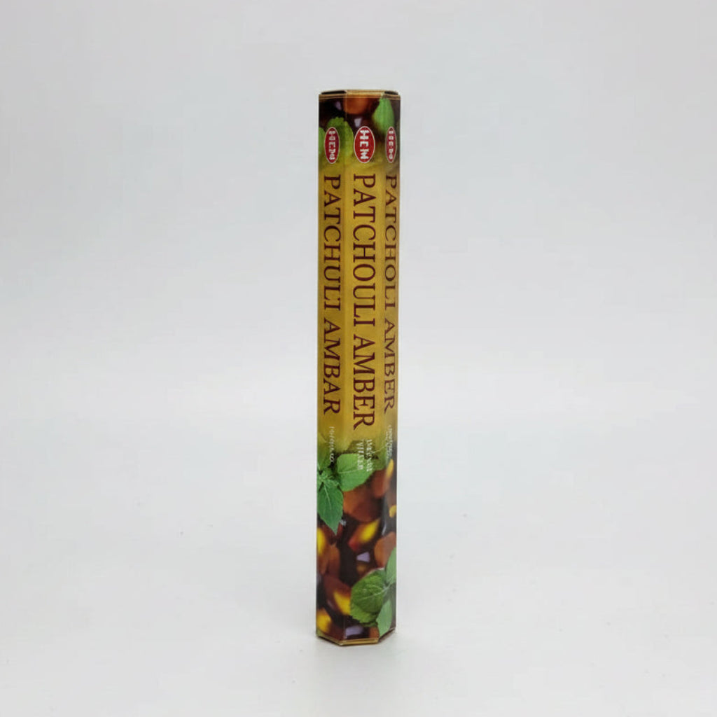 HEM patchouli amber incense sticks displayed on a white background. - Clover's Charm