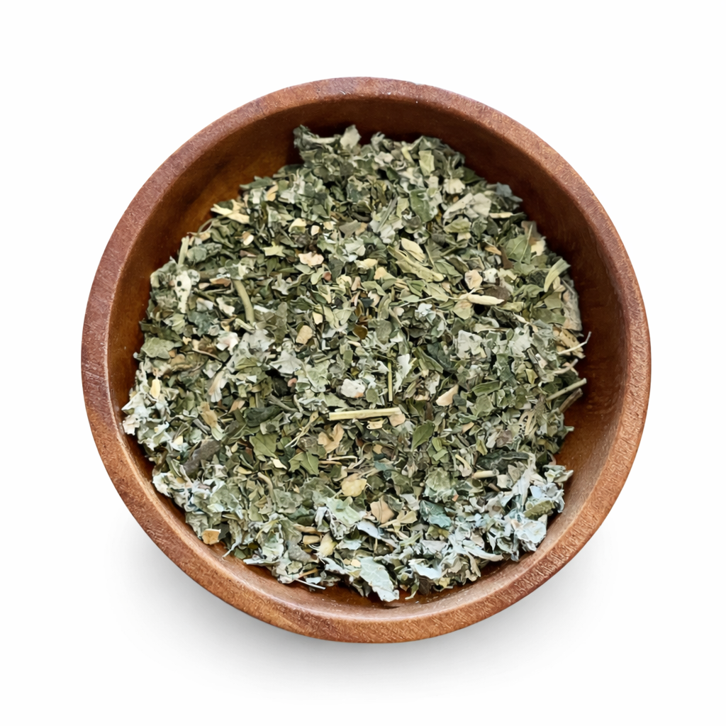 Wooden bowl filled with happy hormone balance tea dried herbs on a white background. -Clover's Charm