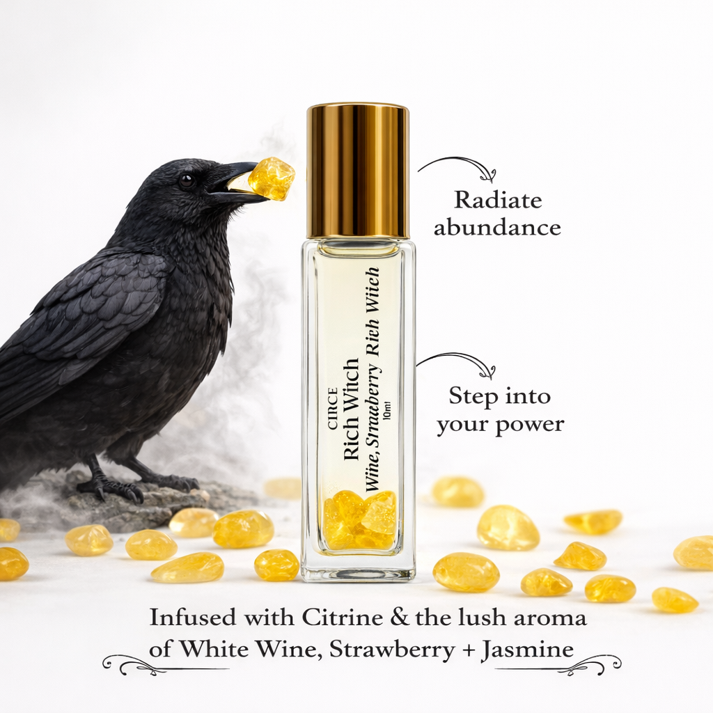 Perfume bottle with a crow and citrine stones on a white background. -Clover's Charm