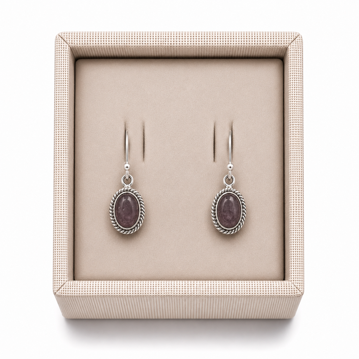 Sterling Silver Bezeled Oval Rose Quartz Dangle Earrings in a decorative box on a white background -Clover's Charm. 