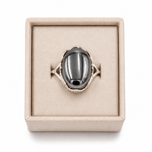 A sterling silver cross banded Terahertz ring in a decorative box on a white background -Clover's Charm.