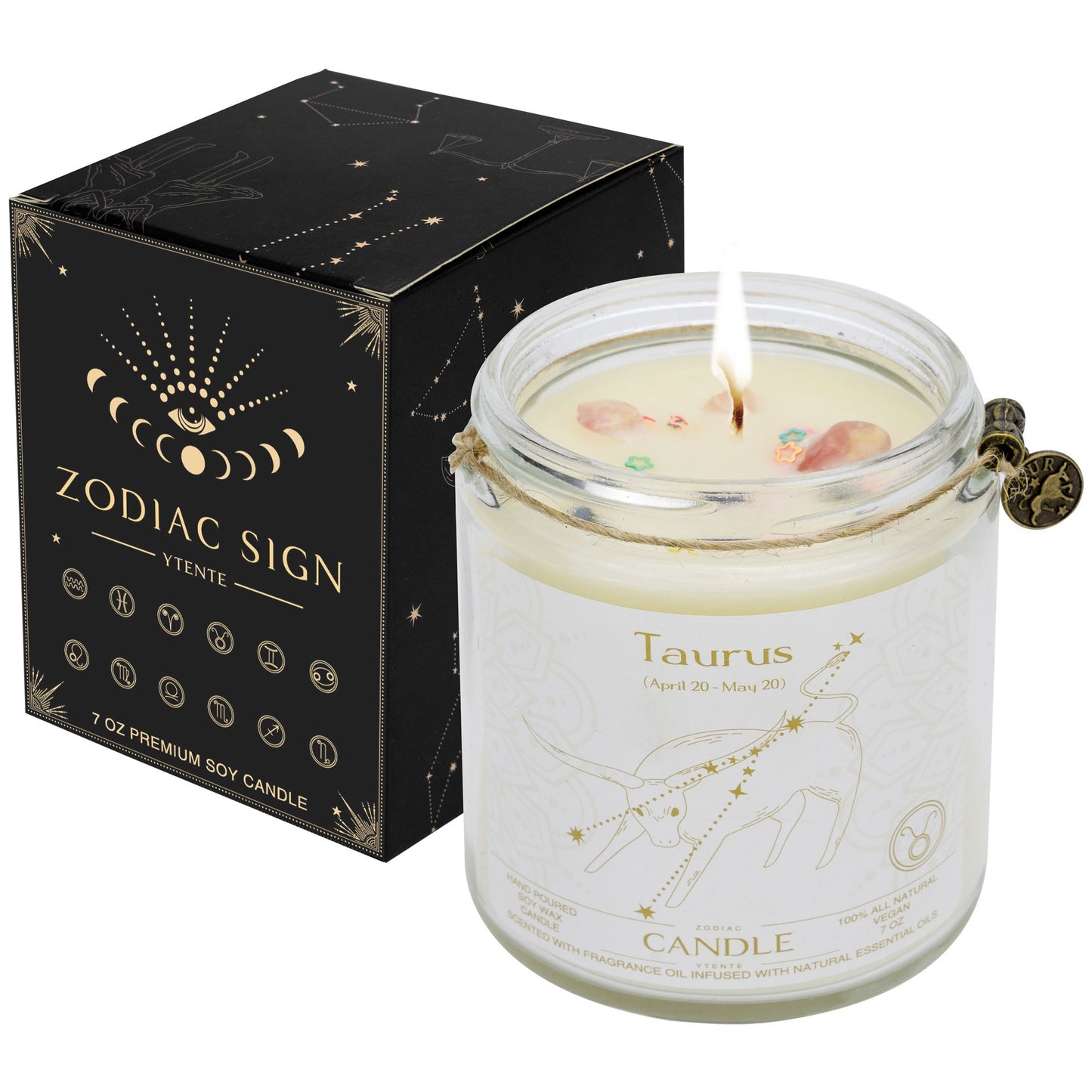Lit Taurus zodiac candle in clear glass jar with lavender sprigs visible wax crystals and printed astrology design with size dimensions shown