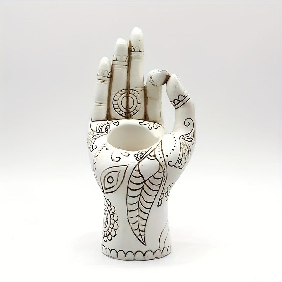 White resin Zen inspired hand incense holder with etched patterns displayed upright on a plain background.
