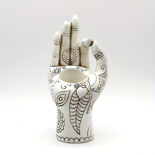 White resin Zen inspired hand incense holder with etched patterns displayed upright on a plain background.

