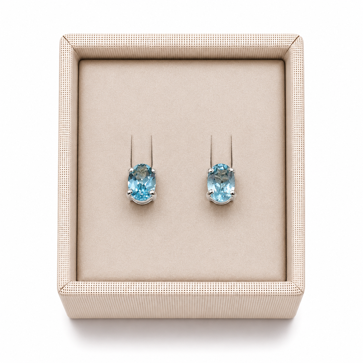 Aquamarine sterling silver stud post earrings in a display box on a white background. - Clover's Charm