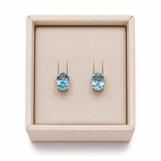 Aquamarine sterling silver stud post earrings in a display box on a white background. - Clover's Charm