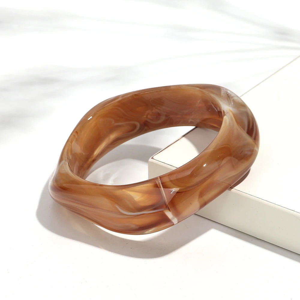 Brown marbled bracelet on a white surface