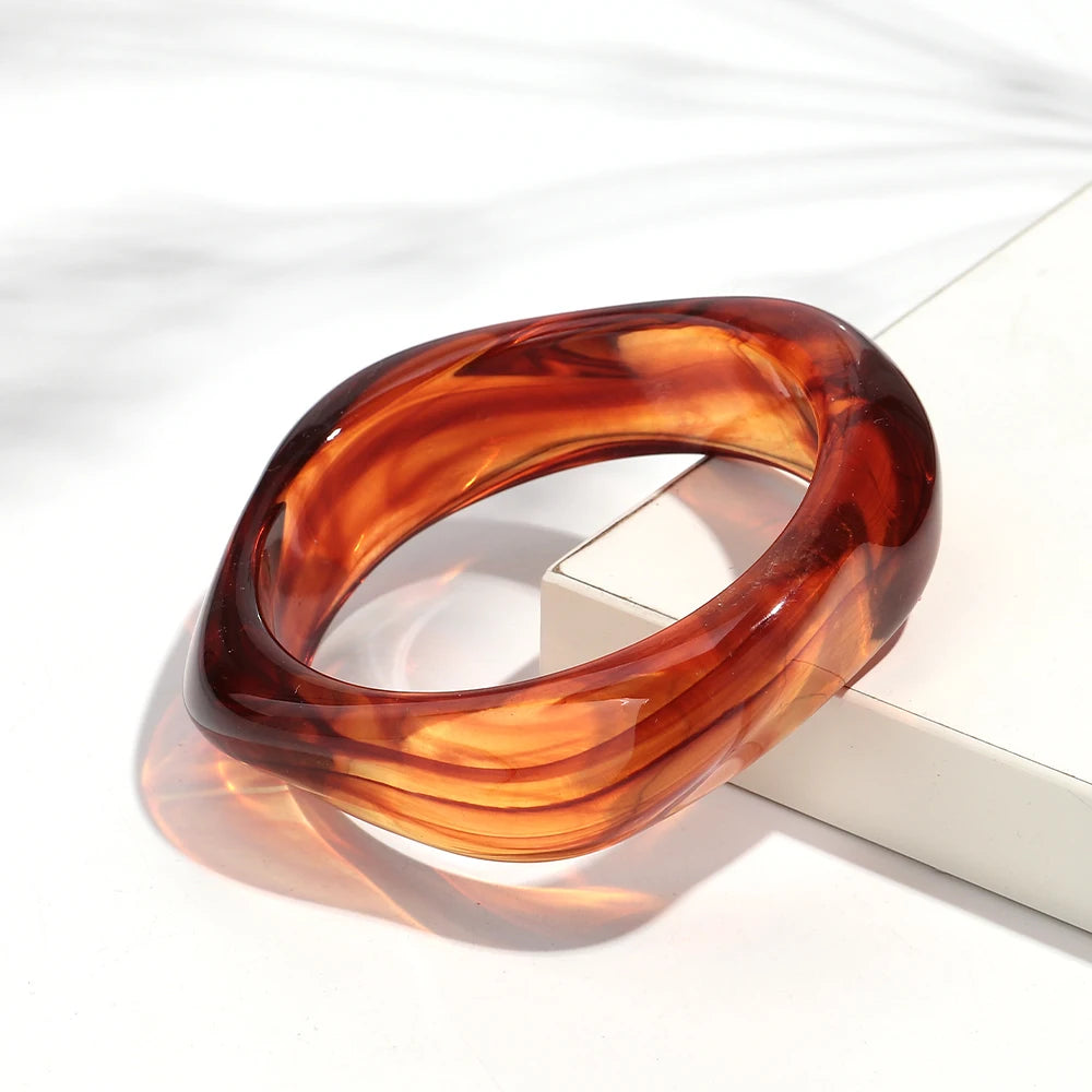 Brown tortoiseshell bracelet on a white surface