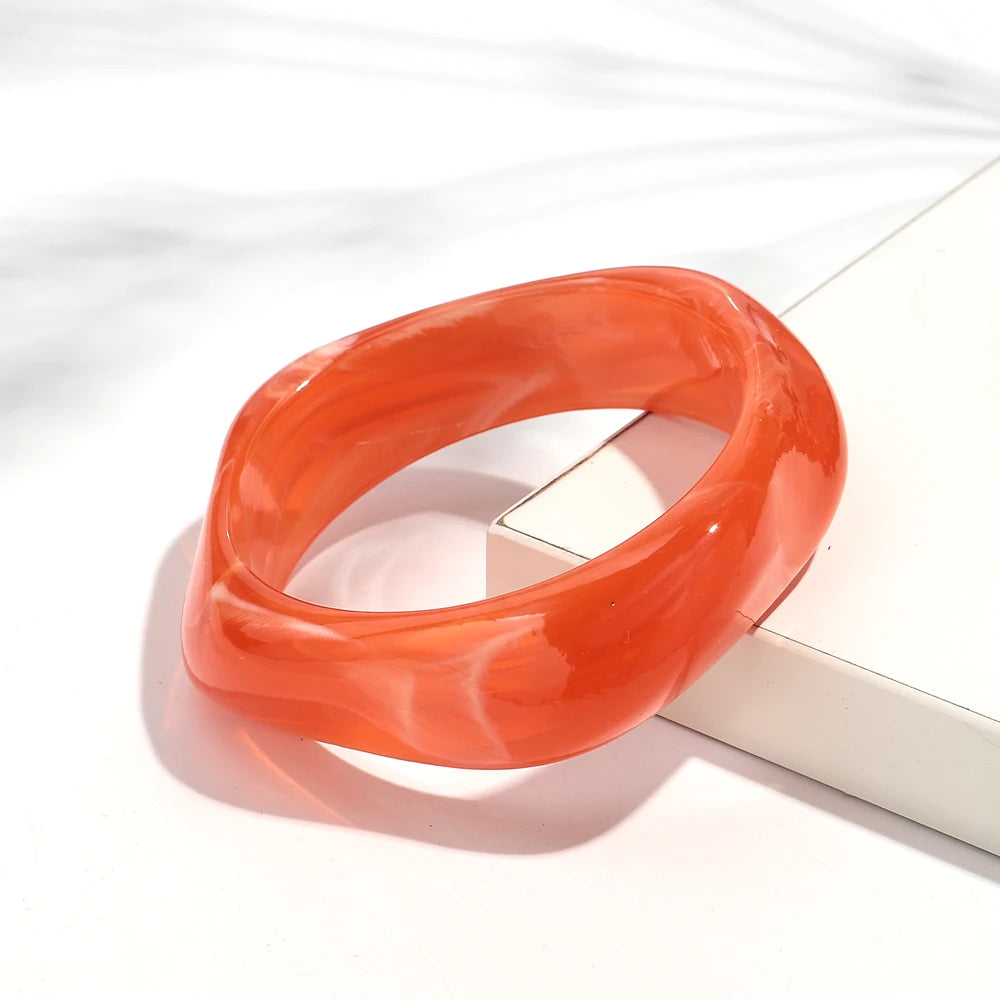 Orange bracelet on a white background