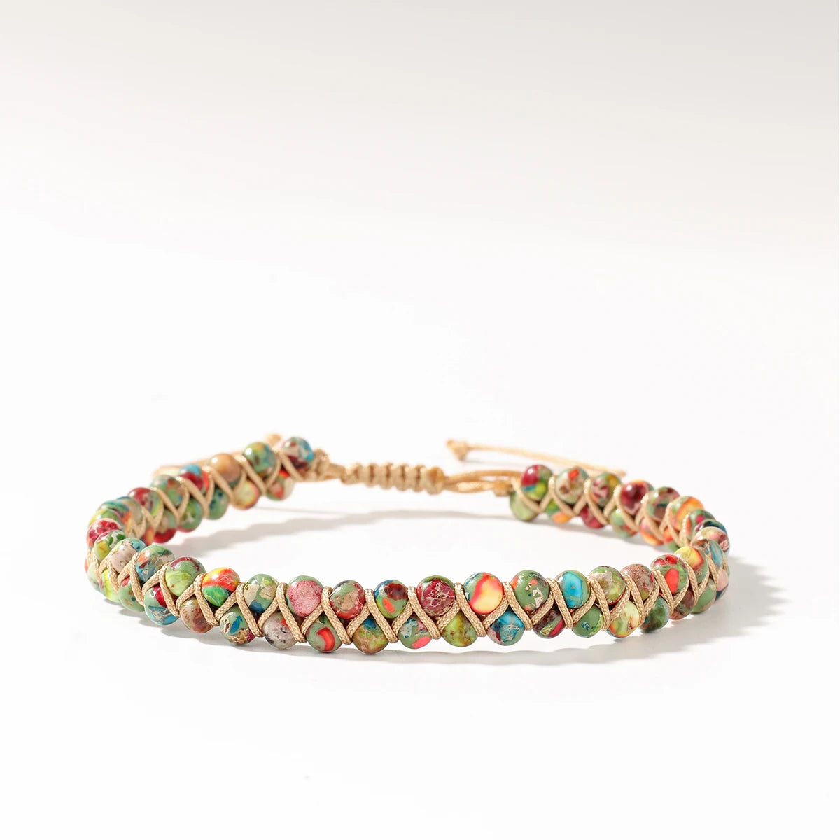 Adjustable boho multicolored beaded bracelet on a white background