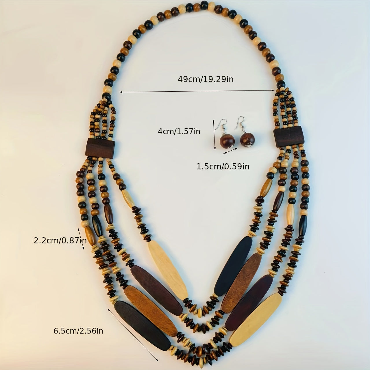 Wooden bead necklace and earrings with measurements on a light background