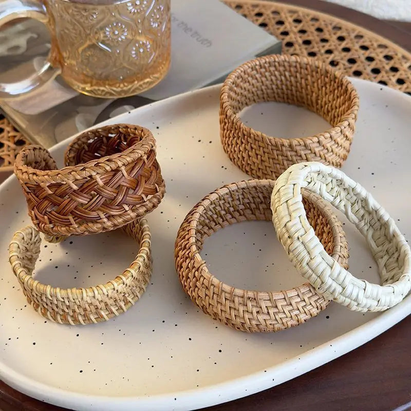 Boho woven wood bracelet bamboo rattan cuff and bangle styles displayed on table
