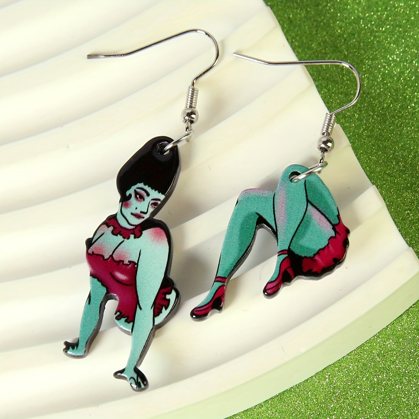 Cartoon magician’s assistant acrylic dangle earrings with green character design and alloy ear hooks