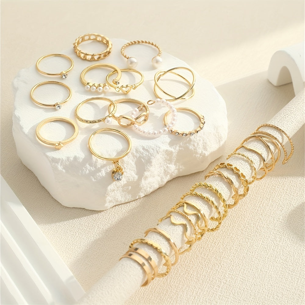 Celestial Coquette Stacking Rings Set – 28‑Piece Rhinestone & Infinity Charm Gold Ring Collection on white background