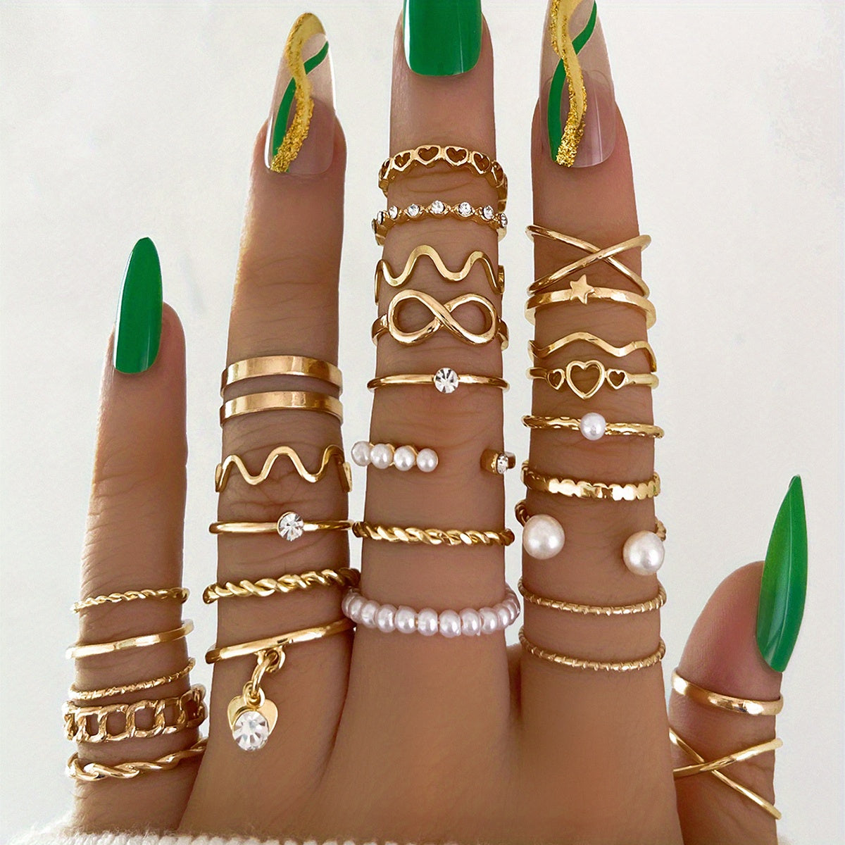 Celestial Coquette Stacking Rings Set – 28‑Piece Rhinestone & Infinity Charm Gold Ring Collection on a hand