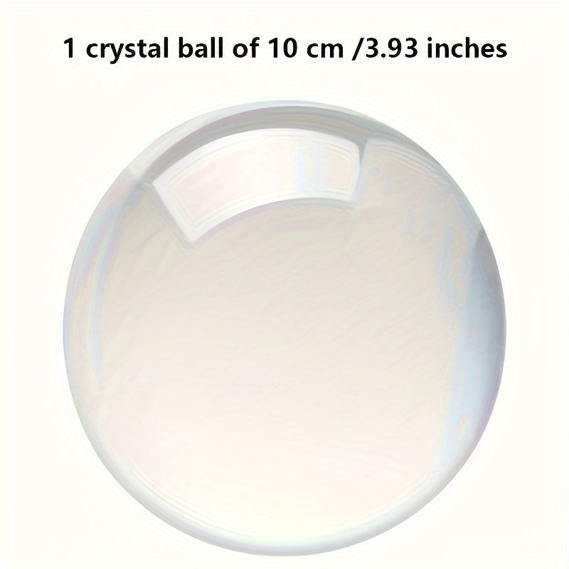 Clear glass sphere on a beige cushion against a white background