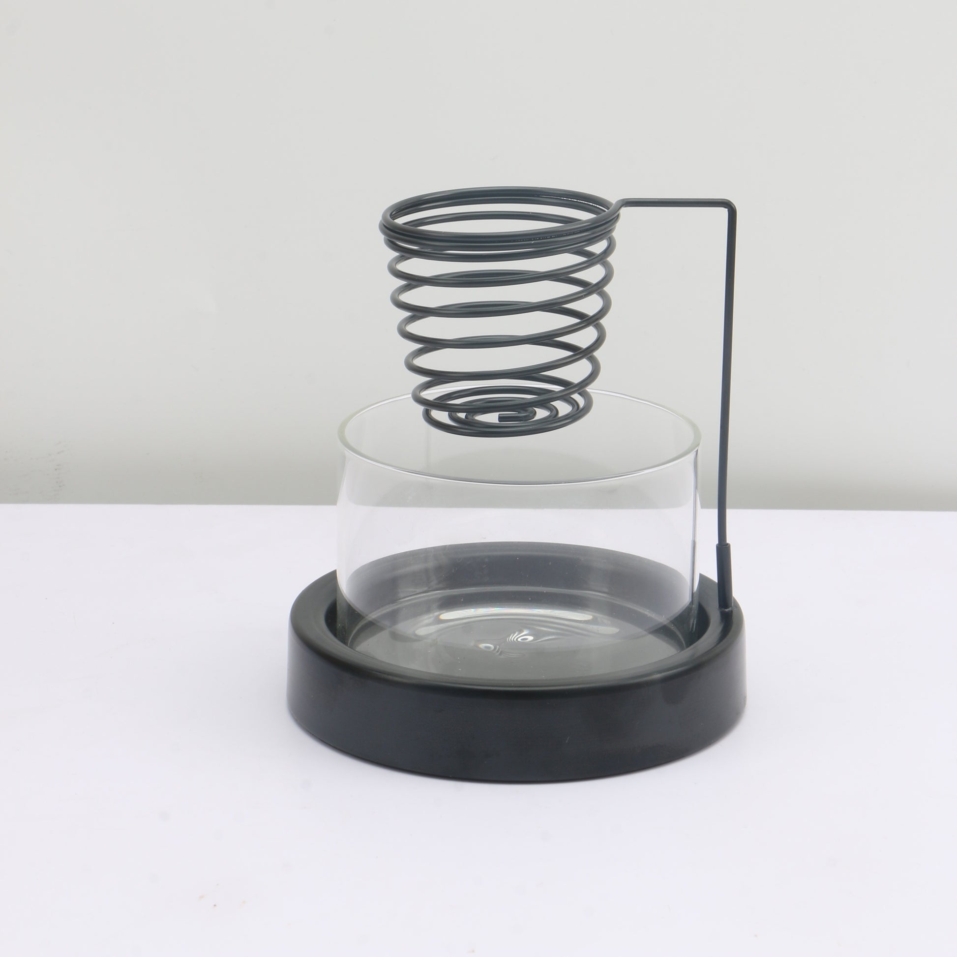 Minimal clear glass incense burner bowl with black metal base