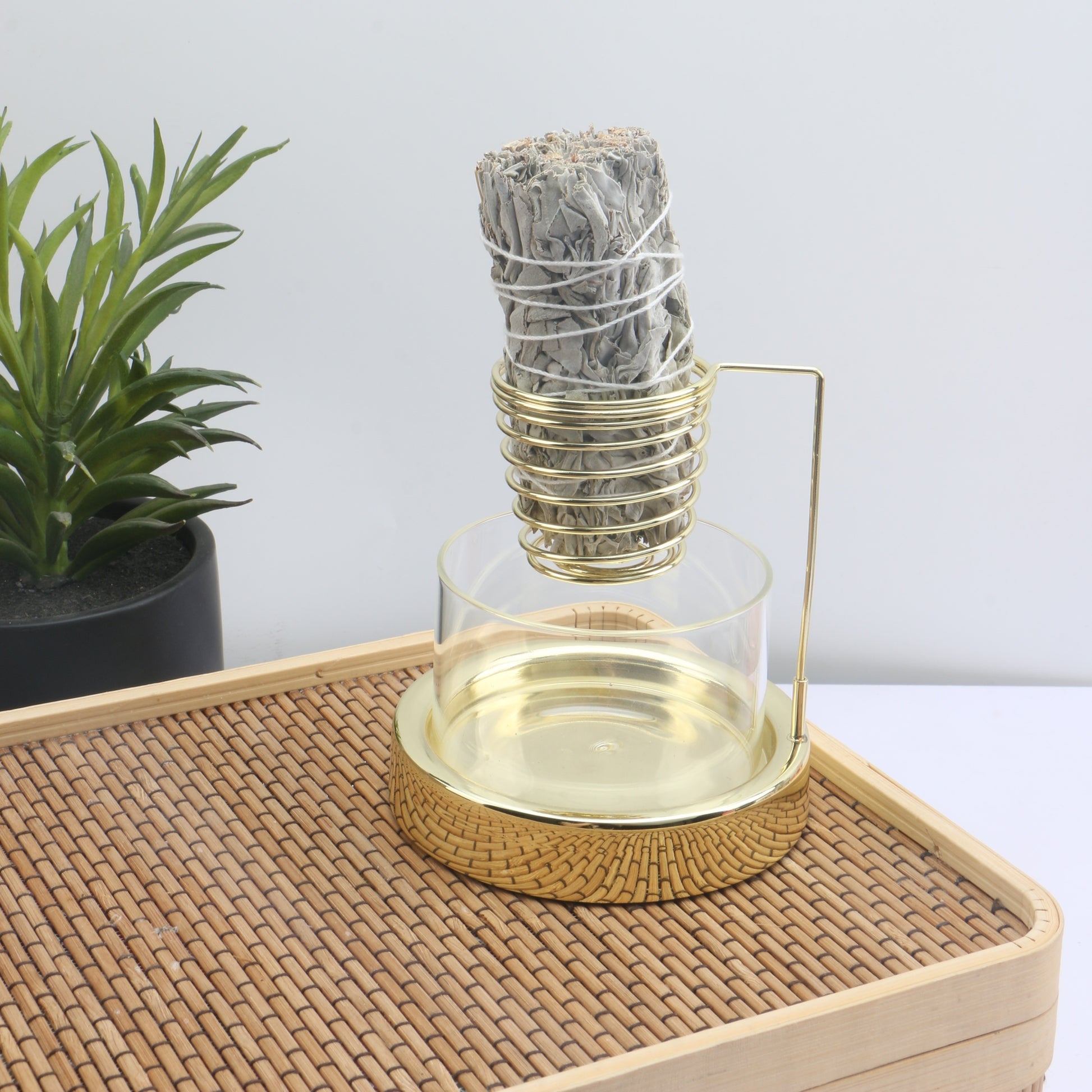 Glass sage incense burner bowl displayed with botanical incense and decor