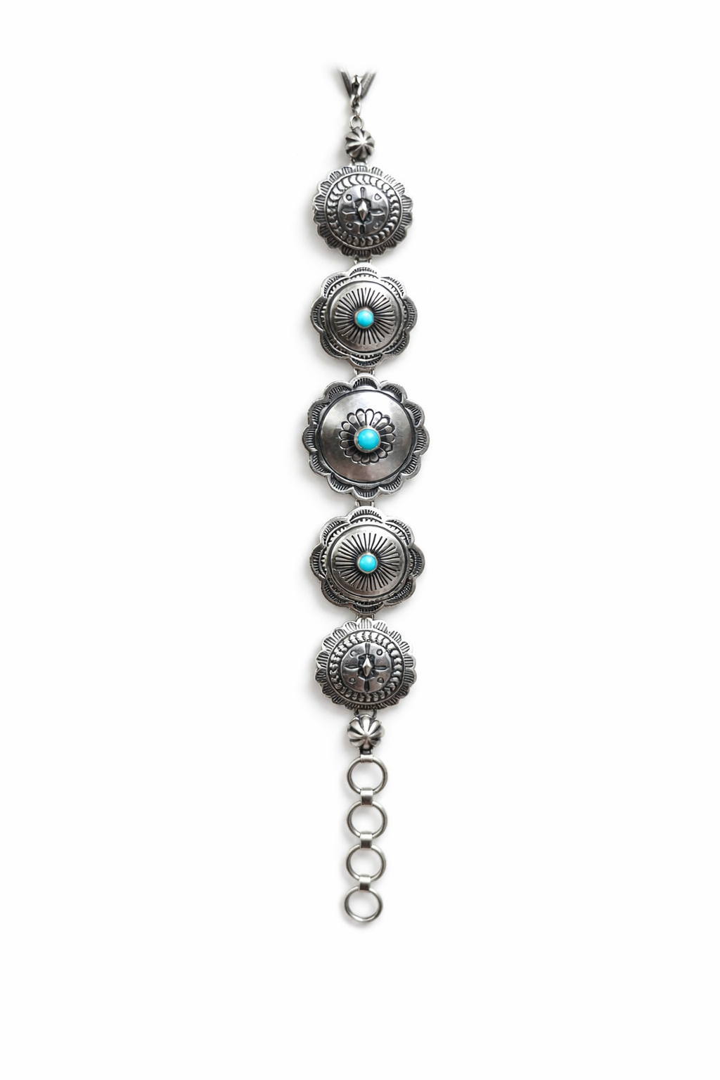 A sterling silver Concho link bracelet with Sleeping Beauty turquoise stones on a white background