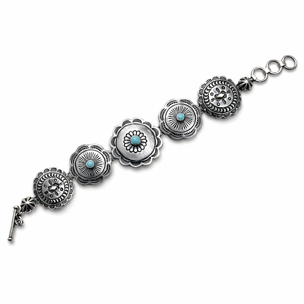 A sterling silver Concho link bracelet with Sleeping Beauty turquoise stones on a white background