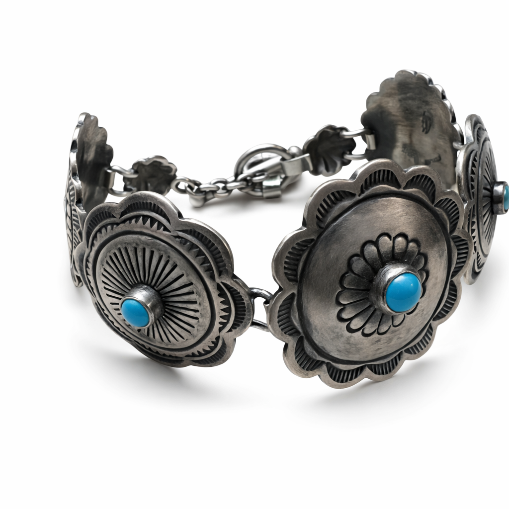 A closeup of a sterling silver Concho link bracelet with Sleeping Beauty turquoise stones on a white background