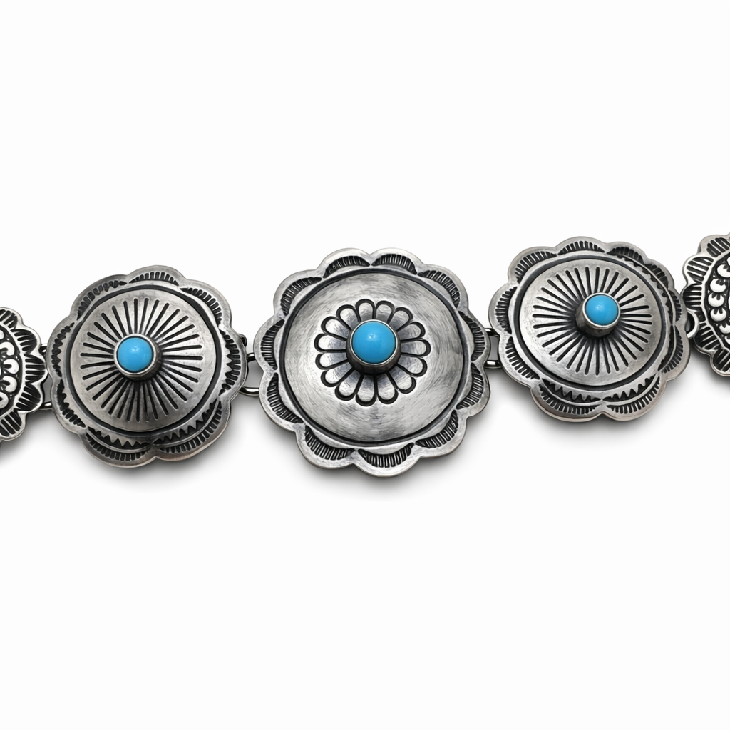 A closeup view of a sterling silver Concho link bracelet with Sleeping Beauty turquoise stones on a white background