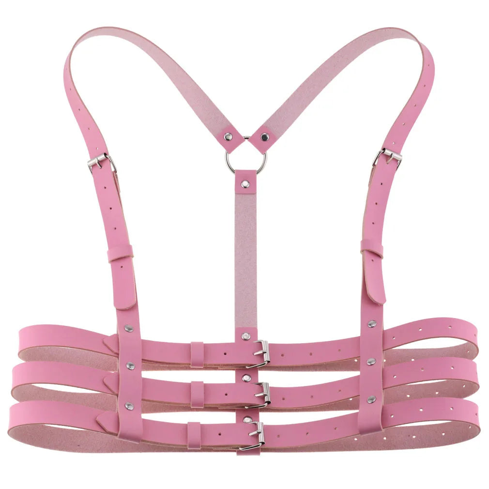 Pink PU leather harness with metal hardware on a white background