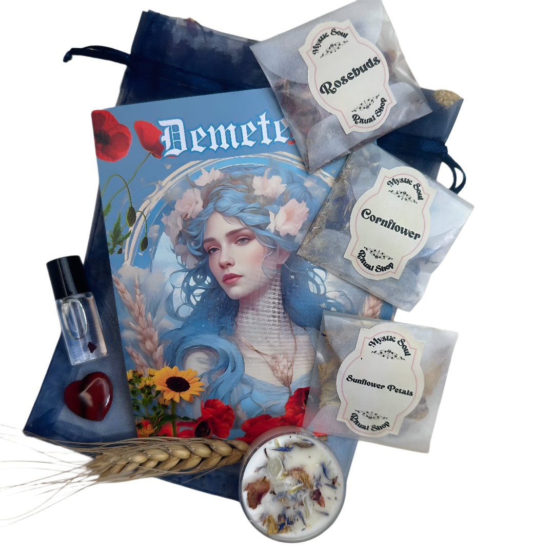 Gifting set with 'Demeter' magazine, tea bags, and a small bottle on a white background