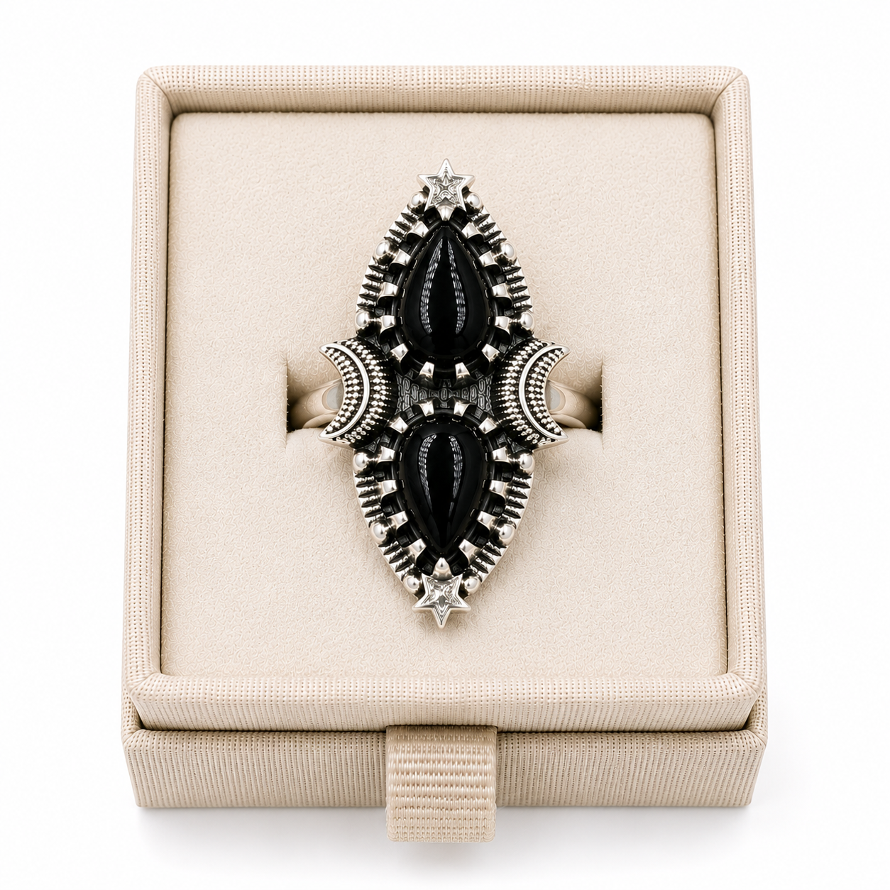 Sterling silver celestial statement ring with two teardrop-shaped black onyx cabochons displayed in a soft linen jewelry box -Clover's Charm.