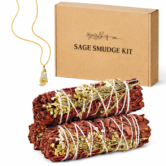 Sage smudge kit with two bundles of sage and a necklace on a white background