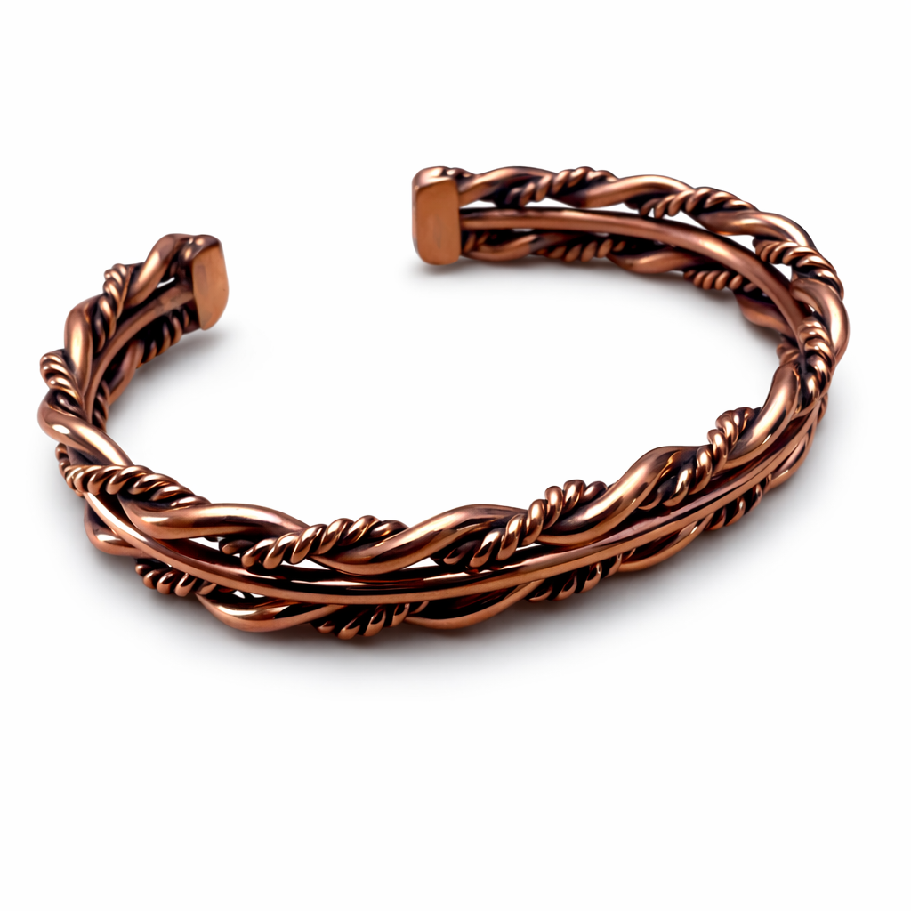 A front view of an Elaine Tahe copper twist cuff bracelet with multi wire Navajo twist design on a white background.