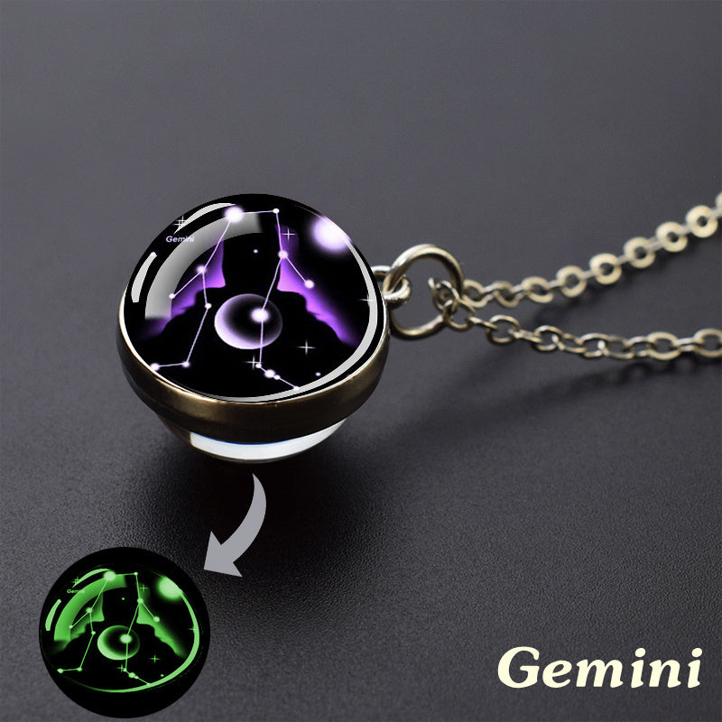 Necklace with a pendant featuring the Gemini zodiac sign design, glowing in the dark.