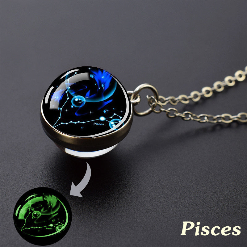 Necklace with zodiac pendant, specifically Pisces, on a dark background
