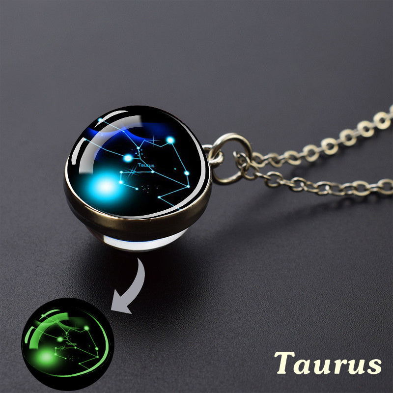 Necklace with a pendant displaying the Taurus constellation on a dark background