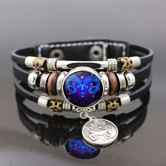 Multistrand leather Aries zodiac bracelet with decorative beads and a central blue pendant on a gray background