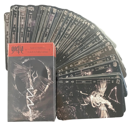 Goetia deck of cards with black and white illustrations on a dark background with a card spread