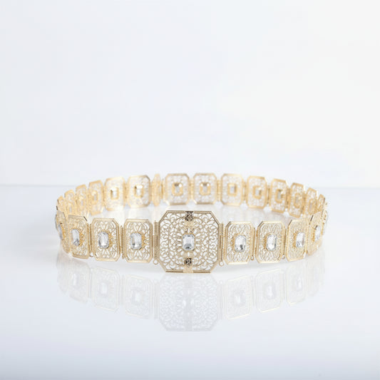 Gold bracelet with diamond accents on a white background