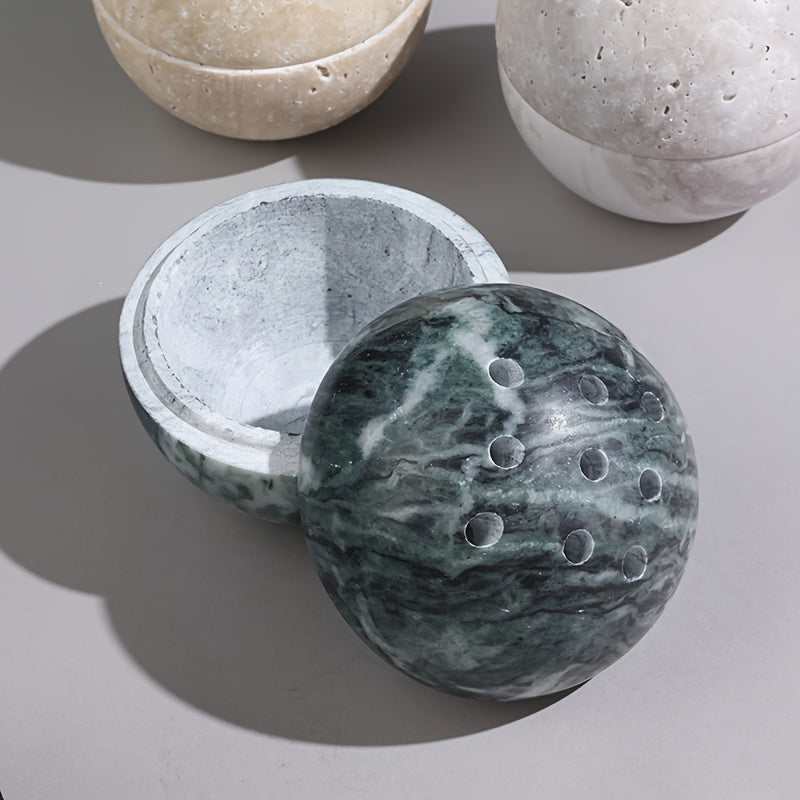 Green marble sphere incense burner styled as sculptural home decor accent