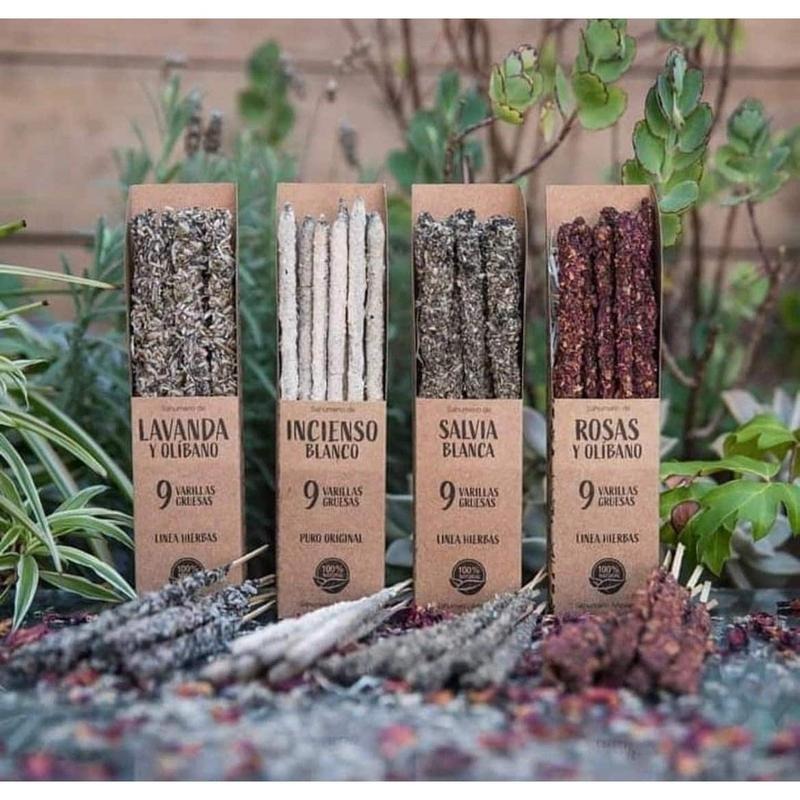 Hand rolled botanical incense sticks made with natural herbs flowers and resins displayed in rustic packaging