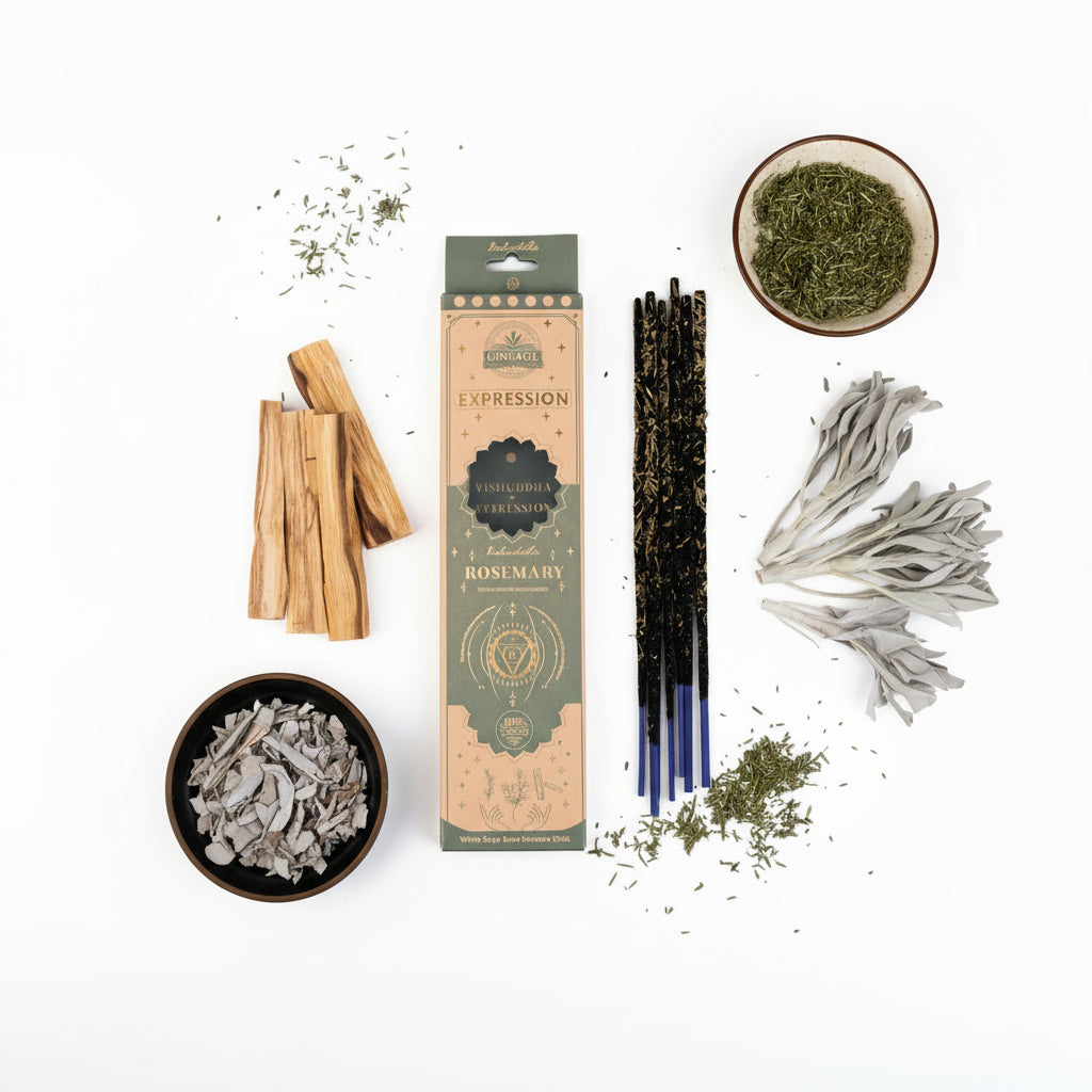 Ginsage Expression Rosemary incense packaging on a white surface with herbs and herbal incense sticks.