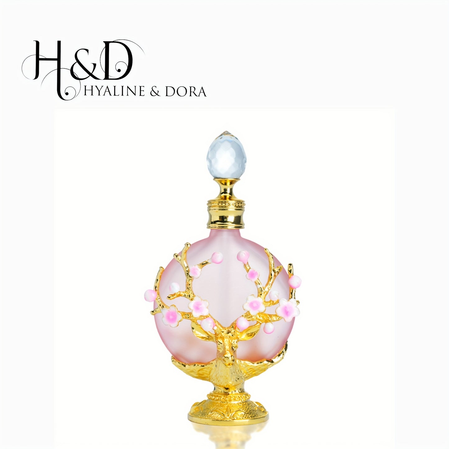 H&D Hyaline & Dora Elegant pink crystal perfume bottle with floral branch detailing
