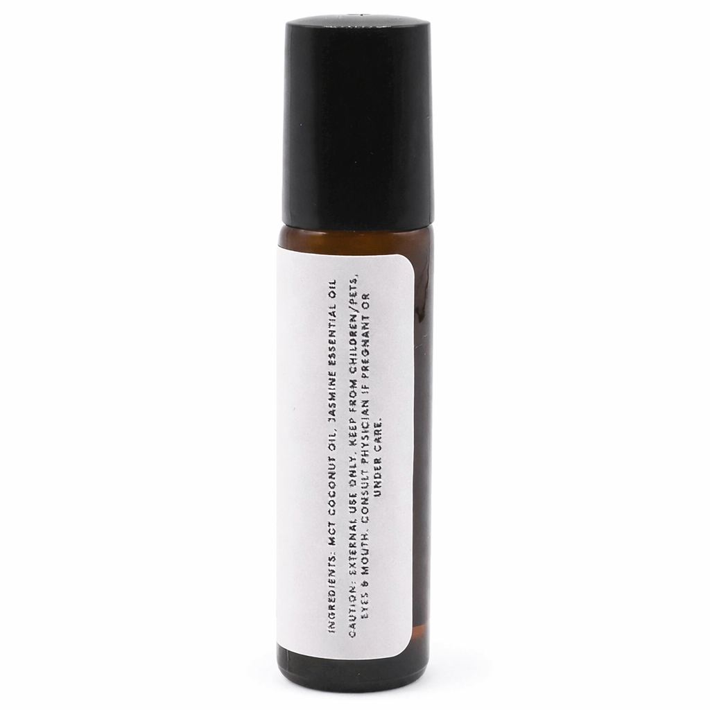 Roll-on bottle with black cap and white label on a white background -Clover's Charm