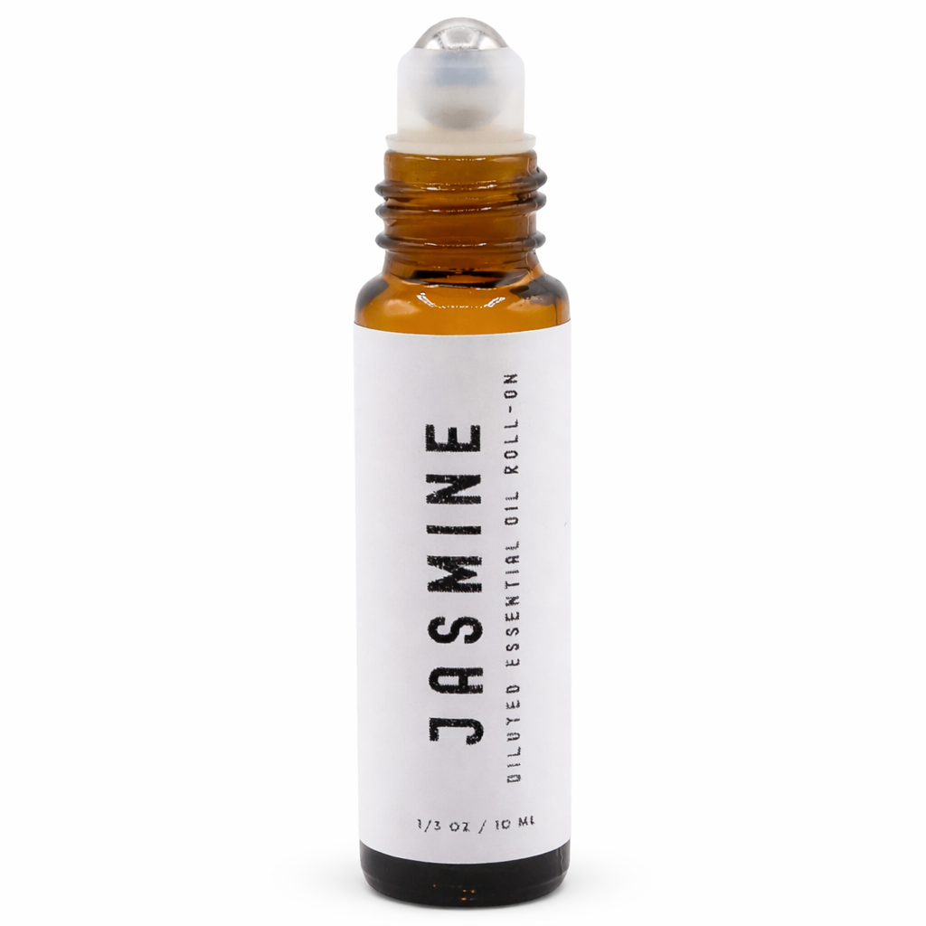 Roll-on bottle of jasmine essential oil on a white background - Clover's Charm