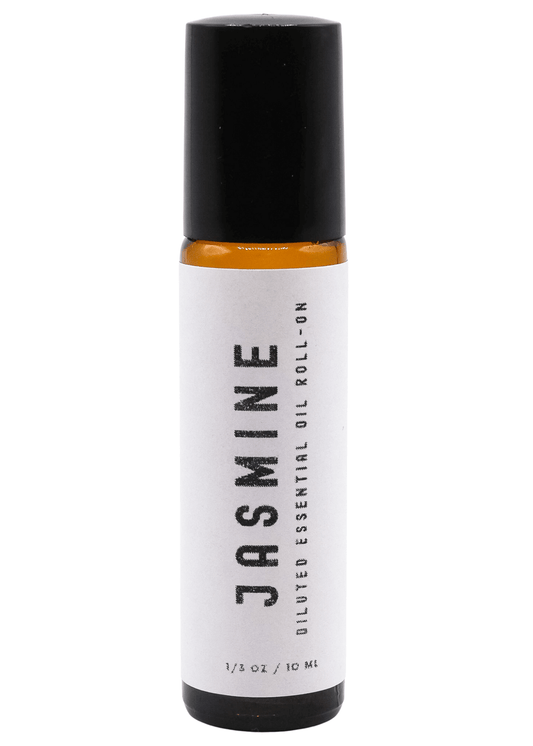 Roll-on bottle of Jasmine diluted essential oil on a white background